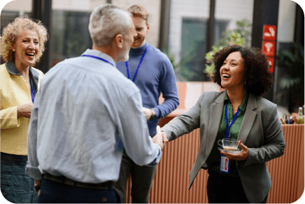 People shaking hands at an event